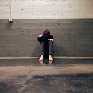 woman sitting down dealing with anger